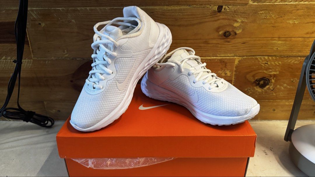 Nike Revolution 6 NN White Sneakers (Category: Sneakers) located in Makati City. Submitted by thegeuxarchive (Listing ID 1439440965, Image 1). Description: RFS: wrong Size Selling as is - Nike Revolution 6 NN sneakers - Size: US Women's 6.5 - Color: White - Upper: White mesh - Swoosh: White Nike - Made in Indonesia - Condition: Soles show wear - Includes original box.