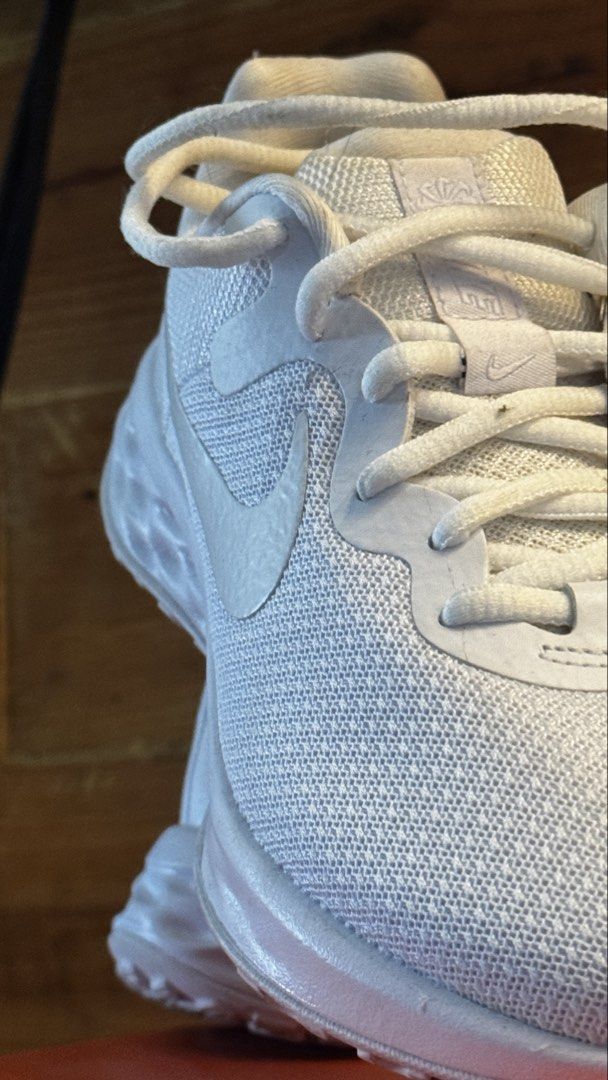 Nike Revolution 6 NN White Sneakers (Category: Sneakers) located in Makati City. Submitted by thegeuxarchive (Listing ID 1439440965, Image 3). Description: RFS: wrong Size Selling as is - Nike Revolution 6 NN sneakers - Size: US Women's 6.5 - Color: White - Upper: White mesh - Swoosh: White Nike - Made in Indonesia - Condition: Soles show wear - Includes original box.
