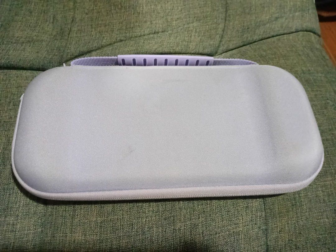 Nintendo Switch 2 Case (Category: Cases & Covers) located in Los Banos. Submitted by acgalamgam (Listing ID 1439510305, Image 2). Description: - Light purple exterior with matching handle - Black interior - Mesh pocket and elastic straps for game cartridges - Zipper closure - Nintendo Switch logo on the front Payment via gcash or BPI online. Shipping via JT or LBC express. Meet up within Los Banos or nearby areas. .