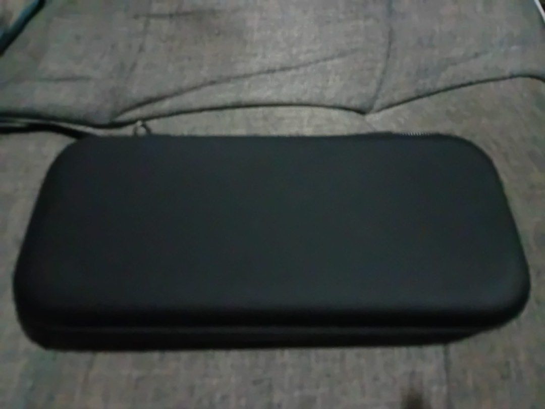 Nintendo Switch Lite Carrying Case (Category: Cases & Covers) located in Los Banos. Submitted by acgalamgam (Listing ID 1439510869, Image 2). Description: - Black carrying case for Nintendo Switch Lite. - Features a secure zipper closure. - Includes a convenient carrying handle. - Interior has a compartment for the console. - Mesh pocket for accessories. - Slots to hold game cartridges. - Protects your Switch Lite during travel and storage. Payme
