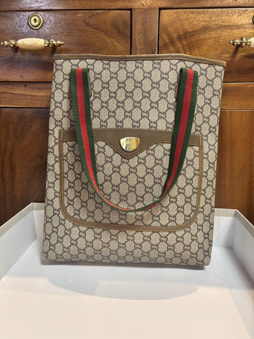 Original/ Authentic Gucci Tote bag (Category: Luxury Bags & Wallets) located in Imus. Submitted by bagsofblessings24 (Listing ID 1439458280, Image 1). Description: Preloved Guaranteed Original Gucci Plus Tote Bag Can be used as laptop or shopping bag Height 15in x Length 12.5 in x Bottom 2.5in Very good condition, minimal fading on the hardware and suede part on the lips and corners ( pls examine photos) Clean inside and outside Will last for man