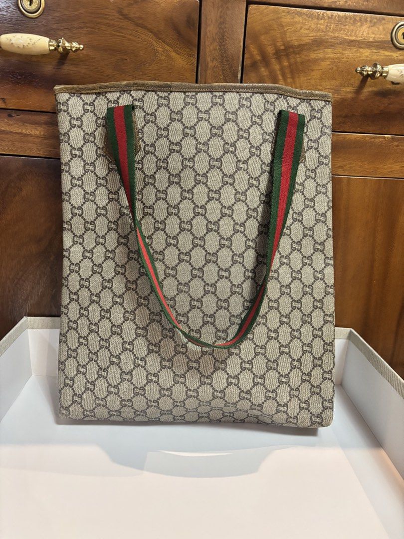Original/ Authentic Gucci Tote bag (Category: Luxury Bags & Wallets) located in Imus. Submitted by bagsofblessings24 (Listing ID 1439458280, Image 2). Description: Preloved Guaranteed Original Gucci Plus Tote Bag Can be used as laptop or shopping bag Height 15in x Length 12.5 in x Bottom 2.5in Very good condition, minimal fading on the hardware and suede part on the lips and corners ( pls examine photos) Clean inside and outside Will last for man