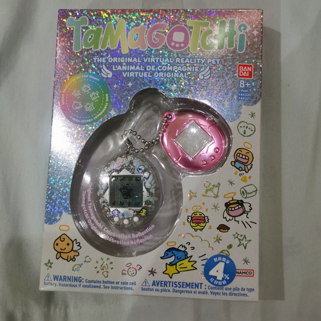 Original Bandai Tamagotchi virtual pet toy (Category: Interactive Toys) located in Manila. Submitted by shopthelatesttrends (Listing ID 1439599773, Image 2). Description: *used once with box *bought in Taiwan April 2026 *The device will begin with the Obaketchi Angel (a ghost character) and depending on how you nurture your character will determine which of the 5 adult Tamagotchi Angel characters you will get! *Check the health meter to ensure yo