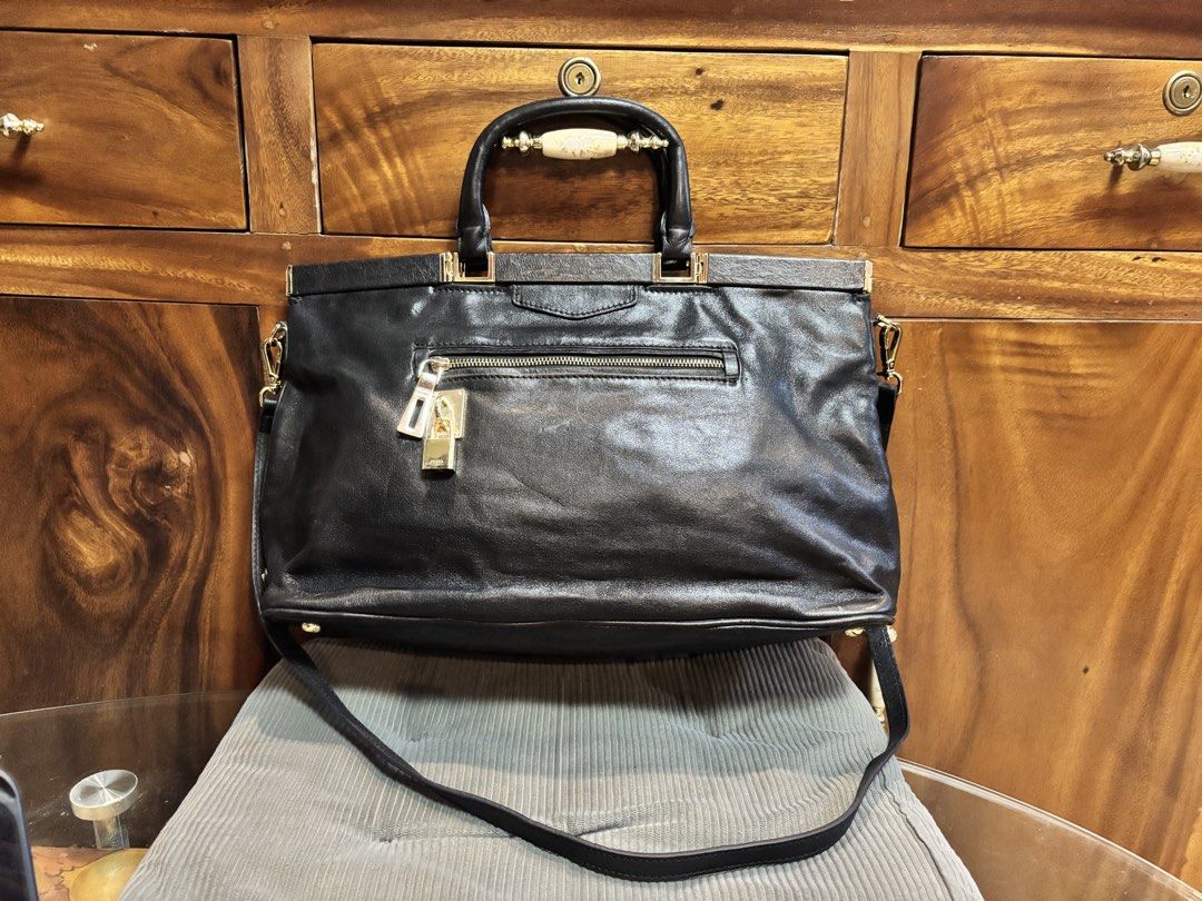 Original Prada Black Leather Two Way bag (Category: Luxury Bags & Wallets) located in Imus. Submitted by bagsofblessings24 (Listing ID 1439510260, Image 2). Description: Preloved Original Prada Nero Soft Calf leather bag with Certificate of authenticity from Prada Two way medium to large Very good condition Original strap Gold hardwares with lock, missing key Exterior flaw - a little bended on handle and small pressed mark on the lips Interior fl