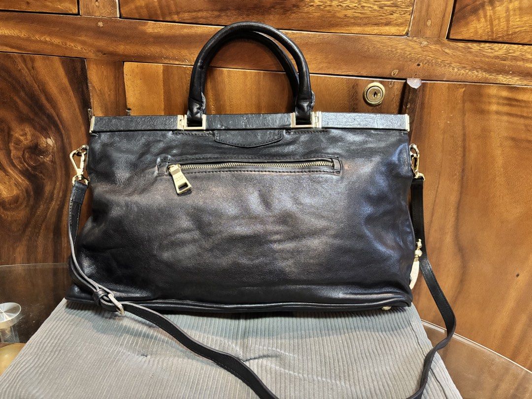 Original Prada Black Leather Two Way bag (Category: Luxury Bags & Wallets) located in Imus. Submitted by bagsofblessings24 (Listing ID 1439510260, Image 3). Description: Preloved Original Prada Nero Soft Calf leather bag with Certificate of authenticity from Prada Two way medium to large Very good condition Original strap Gold hardwares with lock, missing key Exterior flaw - a little bended on handle and small pressed mark on the lips Interior fl