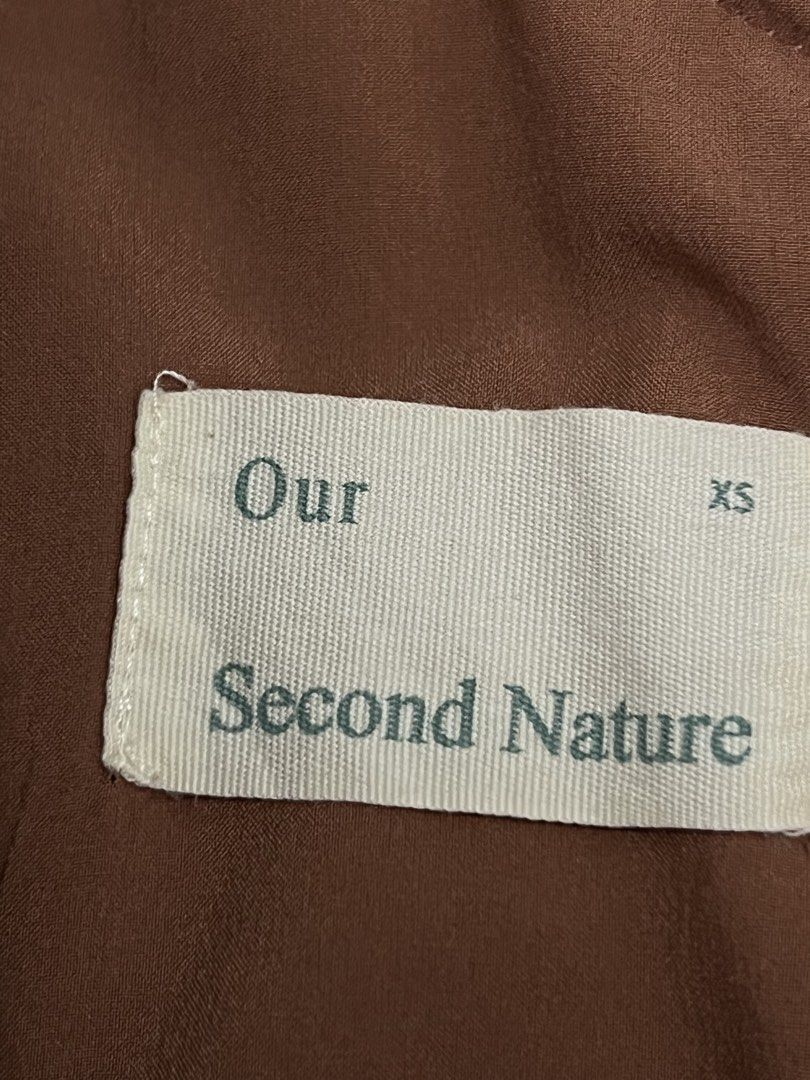 Our Second Nature Sleeveless Dress (Category: Dresses) located in Quezon City. Submitted by riamgt (Listing ID 1439506646, Image 3). Description: - Our Second Nature Sleeveless Dress - Size: XS - Color: Terracotta Brown - Features: Side slit, zipper closure Original price on SG website is 4,200php. Dm for more pictures!.