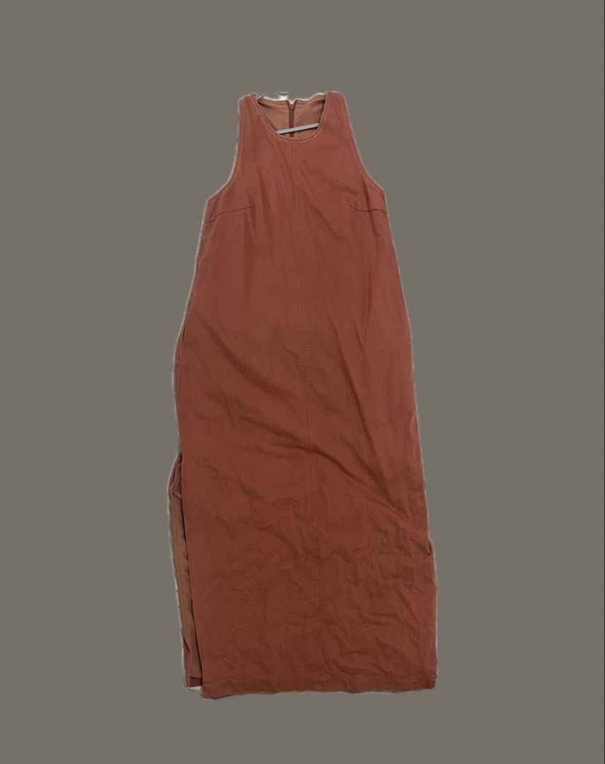 Our Second Nature Sleeveless Dress (Category: Dresses) located in Quezon City. Submitted by riamgt (Listing ID 1439506646, Image 2). Description: - Our Second Nature Sleeveless Dress - Size: XS - Color: Terracotta Brown - Features: Side slit, zipper closure Original price on SG website is 4,200php. Dm for more pictures!.