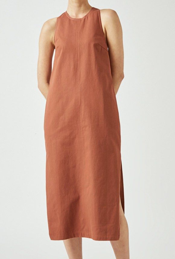 Our Second Nature Sleeveless Dress (Category: Dresses) located in Quezon City. Submitted by riamgt (Listing ID 1439506646, Image 1). Description: - Our Second Nature Sleeveless Dress - Size: XS - Color: Terracotta Brown - Features: Side slit, zipper closure Original price on SG website is 4,200php. Dm for more pictures!.