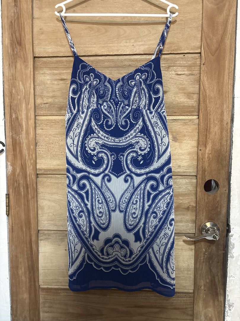 Paisley Print Mini Dress (Category: Dresses) located in Manila. Submitted by icy_________ (Listing ID 1439445529, Image 1). Description: - Brand: INC International Concepts - Style: Mini dress - Print: Blue and white paisley - Neckline: V-neck - Straps: Spaghetti straps - Lining: Black.