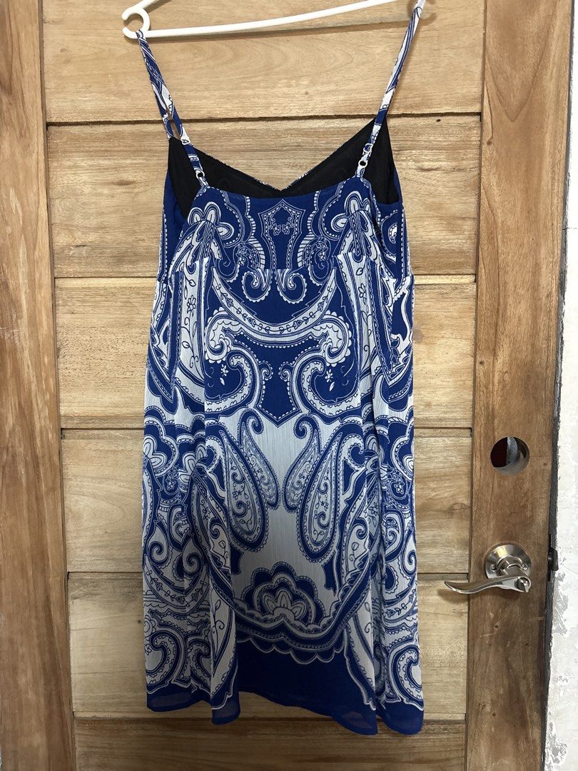 Paisley Print Mini Dress (Category: Dresses) located in Manila. Submitted by icy_________ (Listing ID 1439445529, Image 2). Description: - Brand: INC International Concepts - Style: Mini dress - Print: Blue and white paisley - Neckline: V-neck - Straps: Spaghetti straps - Lining: Black.