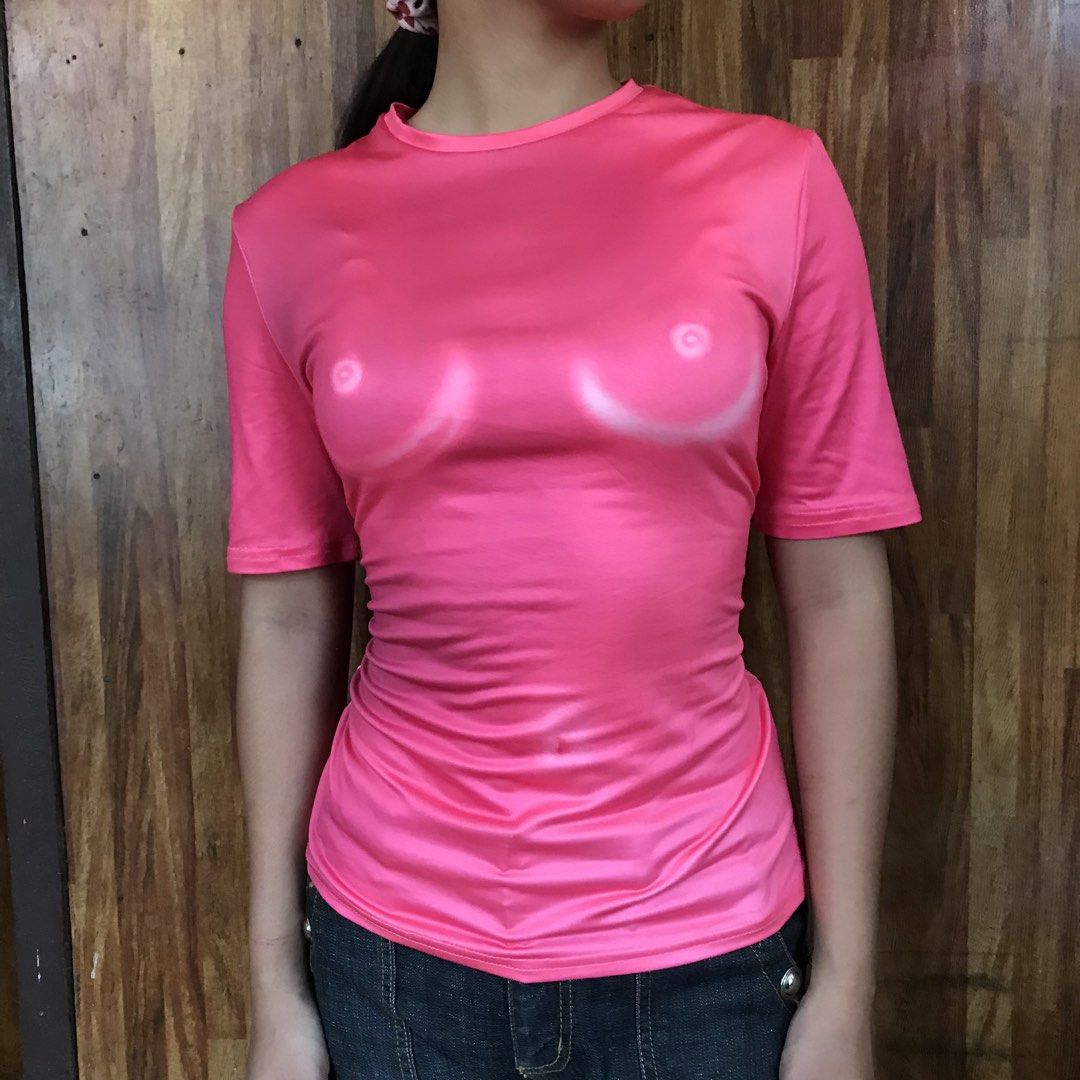 Pink Graphic T-shirt (Category: Shirts) located in Tuguegarao City. Submitted by re.luv (Listing ID 1439569411, Image 2). Description: - Pink graphic t-shirt - Short sleeves - Classic round neckline - Made of a smooth, possibly synthetic material - Form-fitting design - Standard women's size.