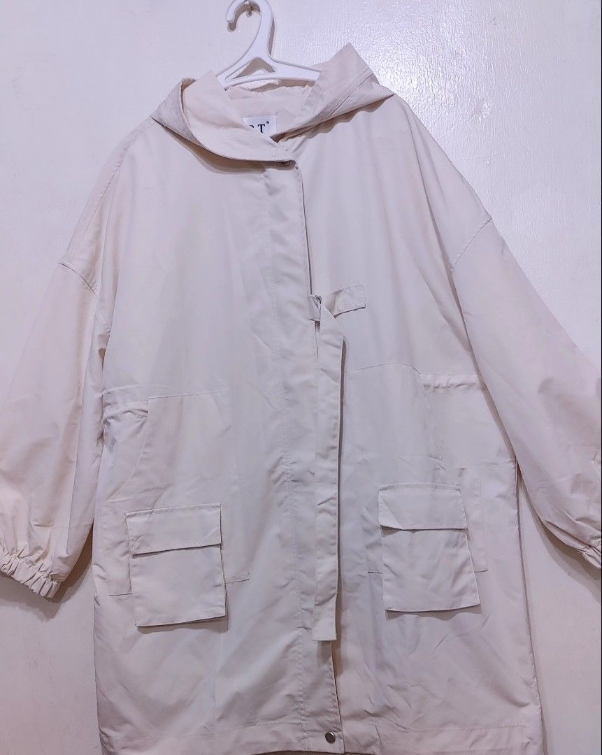 Plus Size Cream-colored Hooded Parka (Category: Coats, Jackets and Outerwear) located in Quezon City. Submitted by chph3rd (Listing ID 1439434376, Image 3). Description: - Cream-colored jacket - Features a hood and two front pockets - Includes a wrap-around belt - Long sleeves - Button closure - Lightweight material - Ideal for layering water repellant. nwot.