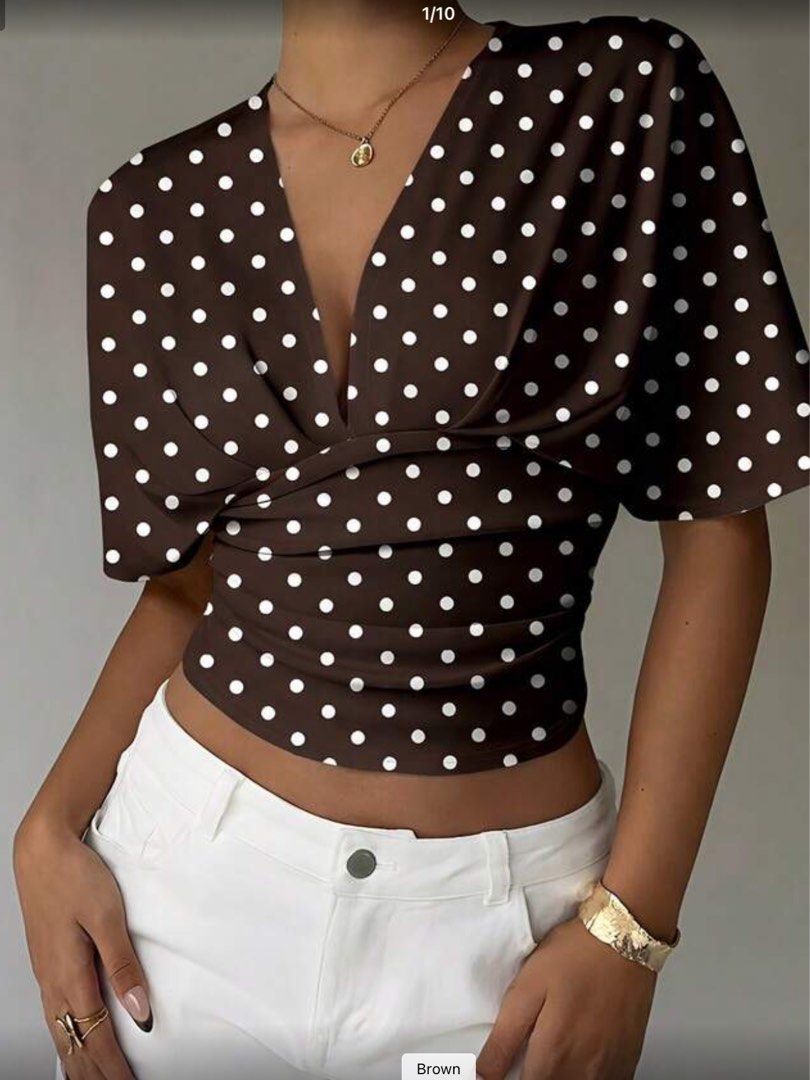 Polka Dot Wrap Top (Category: Blouses) located in Davao. Submitted by suenami01 (Listing ID 1439576589, Image 1). Description: - Stylish wrap top - Features a flattering V-neckline - Short sleeves - Brown base with white polka dots - Cropped style - Perfect for high-waisted bottoms .