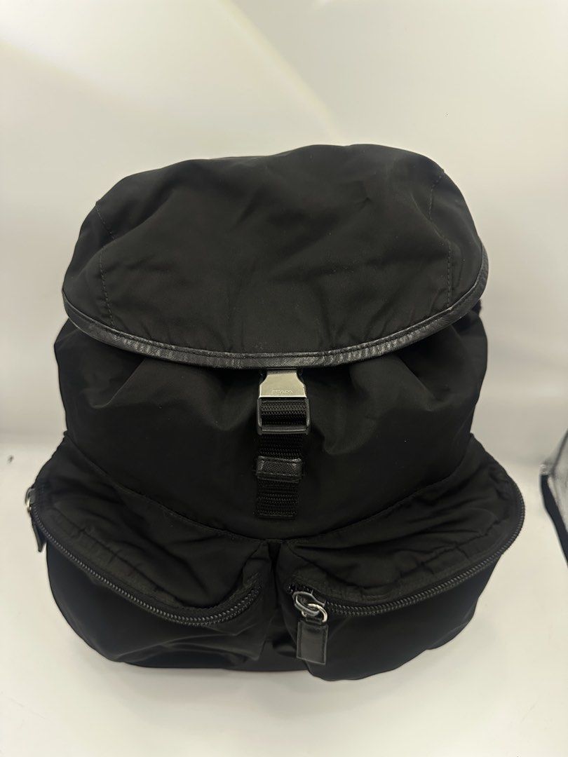 Prada Black Nylon Backpack (Category: Luxury Bags & Wallets) located in Baguio. Submitted by luxukayukay (Listing ID 1439596291, Image 1). Description: - Authentic Prada backpack - Color: Black - Material: Nylon - Features: - Drawstring closure - Two front pockets - Adjustable shoulder straps - Interior: - Zippered pocket - Prada logo tag - Zipper pull: 'LAMPO' - Made in Italy.