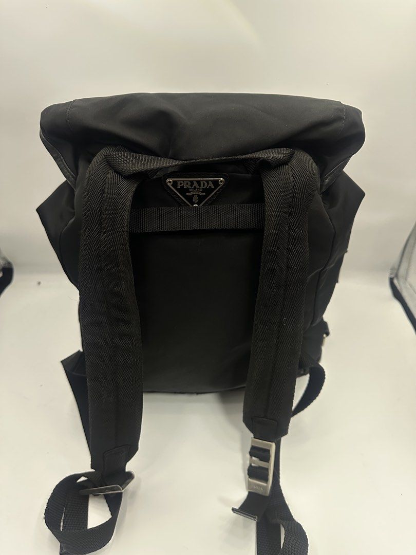 Prada Black Nylon Backpack (Category: Luxury Bags & Wallets) located in Baguio. Submitted by luxukayukay (Listing ID 1439596291, Image 3). Description: - Authentic Prada backpack - Color: Black - Material: Nylon - Features: - Drawstring closure - Two front pockets - Adjustable shoulder straps - Interior: - Zippered pocket - Prada logo tag - Zipper pull: 'LAMPO' - Made in Italy.