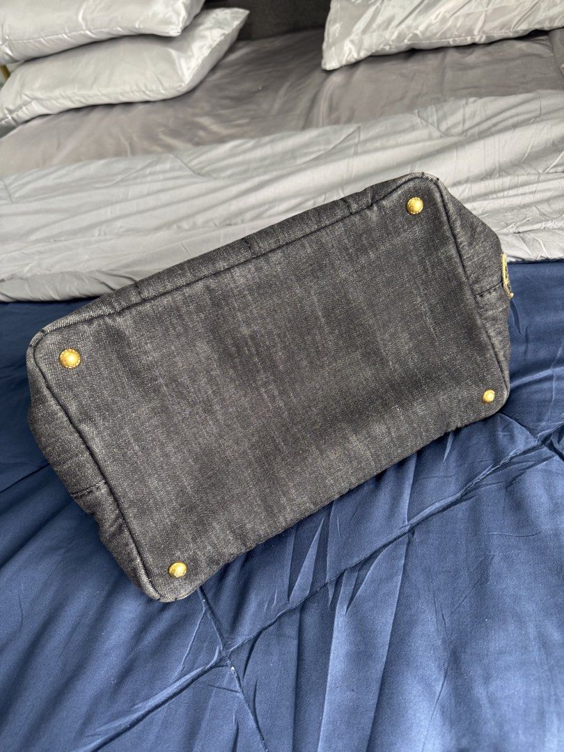 Prada Canapa Denim Tote (Category: Luxury Bags & Wallets) located in Mandaluyong City. Submitted by maria.lj1993 (Listing ID 1439599946, Image 2). Description: Rfs: Decluttering - Authentic Prada denim tote bag - Detachable shoulder strap - Includes authenticity cards - Spacious interior - Slightly damaged on the hardware - Washable small white stain inside Selling it for ₱18,000 if one time payment. But if layaway ₱20,000 Payment method: Layaway