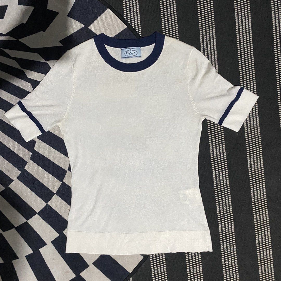 Prada Milano White T-shirt (Category: Tshirts & Polo Shirts ) located in Gapan. Submitted by thrftfnds (Listing ID 1439463926, Image 1). Description: 💎 PRADA MILANO DIMES: 15.5x22.5 COLOR RATE: 10/10 FLAWS: WASHABLE MINOR STAIN PRICE: 600+SF.