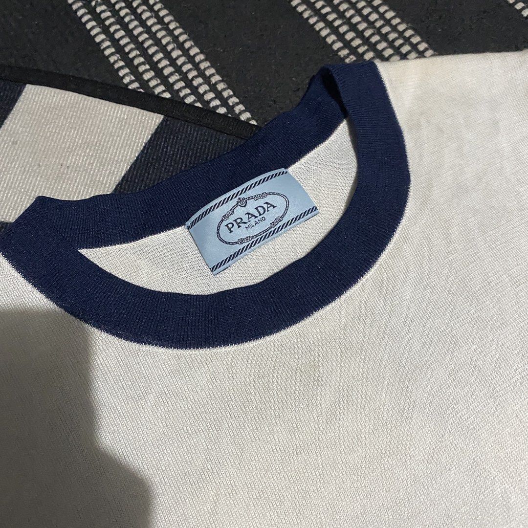 Prada Milano White T-shirt (Category: Tshirts & Polo Shirts ) located in Gapan. Submitted by thrftfnds (Listing ID 1439463926, Image 2). Description: 💎 PRADA MILANO DIMES: 15.5x22.5 COLOR RATE: 10/10 FLAWS: WASHABLE MINOR STAIN PRICE: 600+SF.