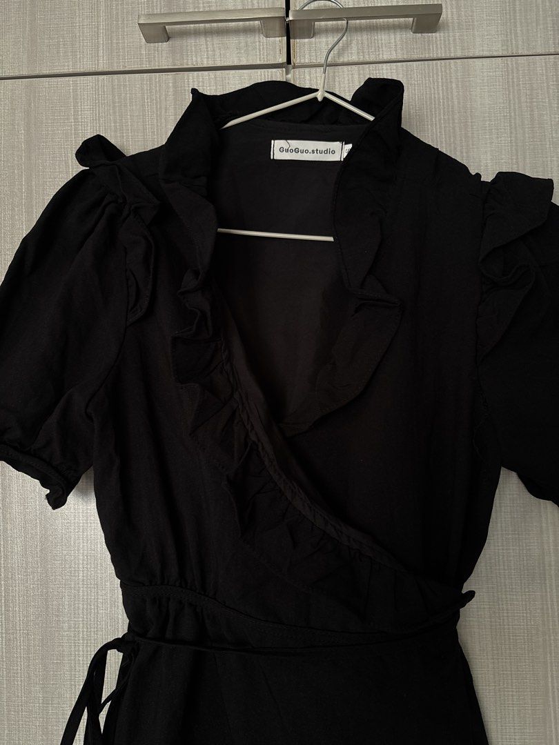 Pretty guoguo.studio Black Wrap Ruffles Dress - (Category: Dresses) located in Taguig. Submitted by danammn (Listing ID 1439514716, Image 2). Description: Super pretty! Great for night out or dressy date night! Love this but my bust looks weird in it 😭 but would keep if it looked nice! Never worn! - GuoGuo.studio black wrap dress - Size: S - Design: Wrap style with ruffle details - Sleeves: Short sleeves - Features: Tie waist for adjustable fit 