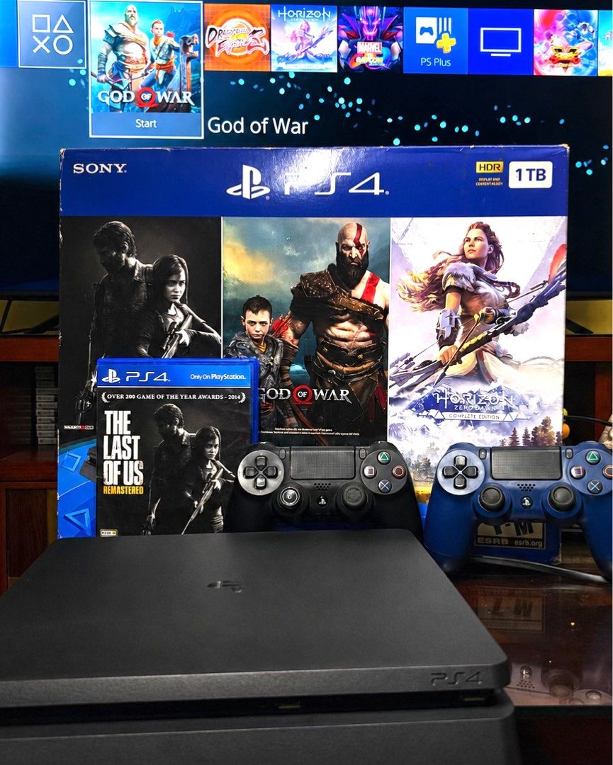 PS4 Slim 1TB Bundle — 2 Controllers + 5 Games (Category: PlayStation) located in San Pedro. Submitted by mycahangela (Listing ID 1439525106, Image 2). Description: PS4 Slim 1TB in great working condition. Everything has been tested and is functioning properly. Ready to plug and play. Includes: • PS4 Slim Console (1TB) • 2x DualShock 4 Controllers • Power Cable • The Last of Us Remastered ( Disc) Digital Games Included: • God of War (2018) • Horiz