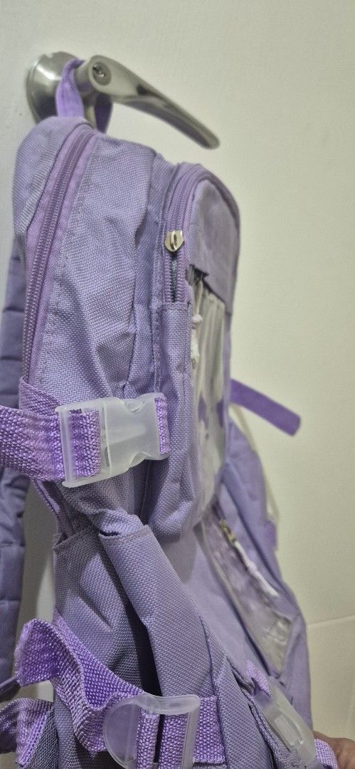 Purple Backpack with Multiple Pockets (Category: Backpacks) located in Mandaluyong City. Submitted by lauracmendoza (Listing ID 1439547170, Image 2). Description: - Purple backpack - Multiple pockets and compartments for organized storage - Adjustable straps and buckles - Main compartment and smaller pockets with clear windows - Durable, textured material - Padded straps for comfort.