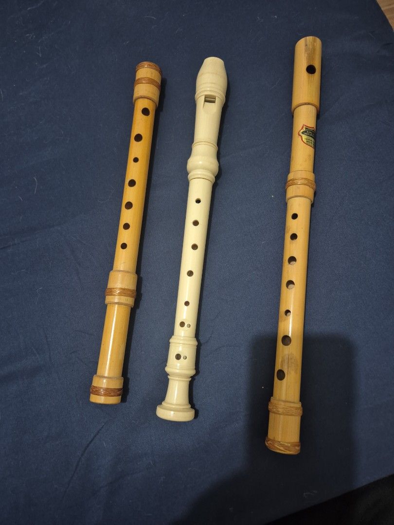 Recorder Flutes - Set of 3 (Category: Musical Instruments) located in Mandaluyong City. Submitted by lauracmendoza (Listing ID 1439544547, Image 1). Description: - Set includes three recorder flutes. - Two flutes are made of bamboo with a natural wood finish. - One flute is white plastic with a matte finish. - All flutes have finger holes. - Designed for playing music..