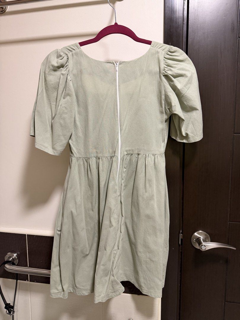 Sage Green Square Neck Dress (Category: Dresses) located in Quezon City. Submitted by bsrys (Listing ID 1439573589, Image 3). Description: - Sage green dress - Square neckline - Short puff sleeves - Fitted waist - Flared skirt - Lightweight fabric - Back zipper closure - With Pockets RFS: Decluttering.