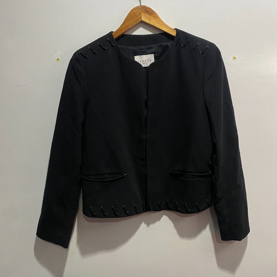 Sandro Paris Lace-up Wool Jacket XS/S (Category: Coats, Jackets and Outerwear) located in Antipolo. Submitted by bentakahitanoano (Listing ID 1439479578, Image 2). Description: Still in good condition This is a Sandro Black Wool Lace-Up Blazer, a sophisticated piece known for its blend of classic tailoring and edgy, decorative details. Size 40 can fit XS/S Pit to pit 19.5 Length 20.5 Design: A collarless, open-front silhouette with a clean, round