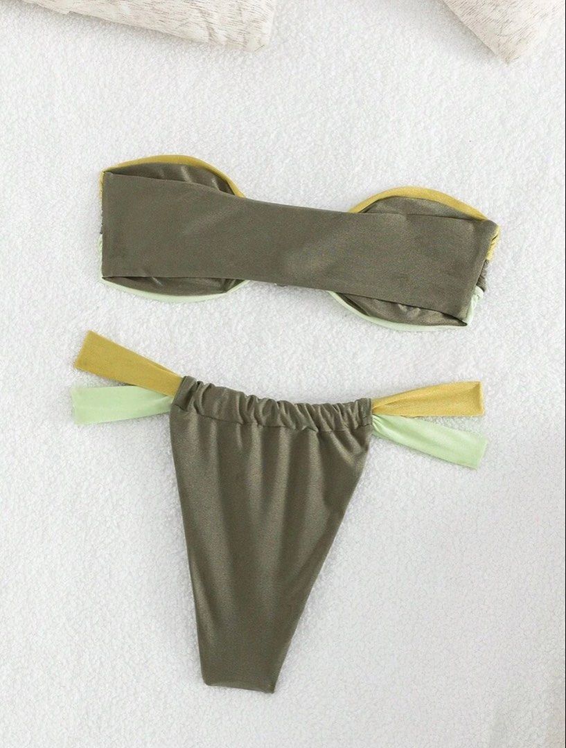 SHEIN Strapless Bikini Set (Category: Bikinis & Swimsuits) located in Valenzuela. Submitted by kimerunn (Listing ID 1439476487, Image 2). Description: - Two-piece bikini set - Strapless top with knot detail - Matching string tie bottom - Color block design - Green and yellow shades - Ideal for beach trips and pool parties.