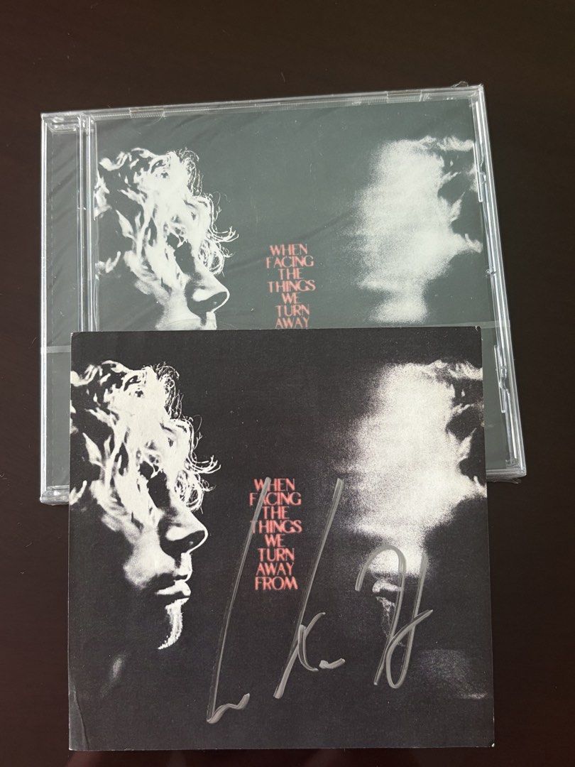 Signed Luke Hemmings - When Facing The Things We Turn Away From CD (Category: CDs & DVDs) located in Manila. Submitted by stefandraboutique (Listing ID 1439460043, Image 1). Description: - Brand new, sealed CD by Luke Hemming from 5 Seconds of Summer SIGNED - Album title: "When Facing The Things We Turn Away From". - Features album art with a black and white image of a face. - Includes the artist's signature on the CD case. - Still in original pa