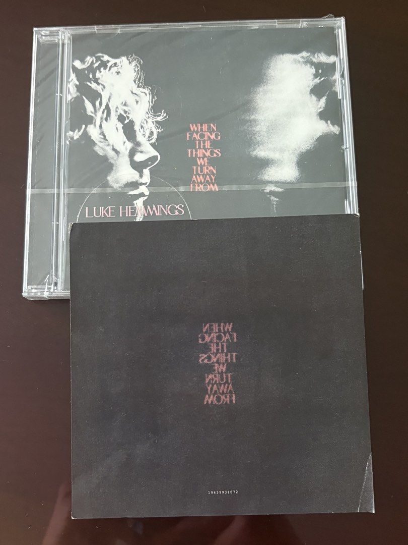 Signed Luke Hemmings - When Facing The Things We Turn Away From CD (Category: CDs & DVDs) located in Manila. Submitted by stefandraboutique (Listing ID 1439460043, Image 2). Description: - Brand new, sealed CD by Luke Hemming from 5 Seconds of Summer SIGNED - Album title: "When Facing The Things We Turn Away From". - Features album art with a black and white image of a face. - Includes the artist's signature on the CD case. - Still in original pa