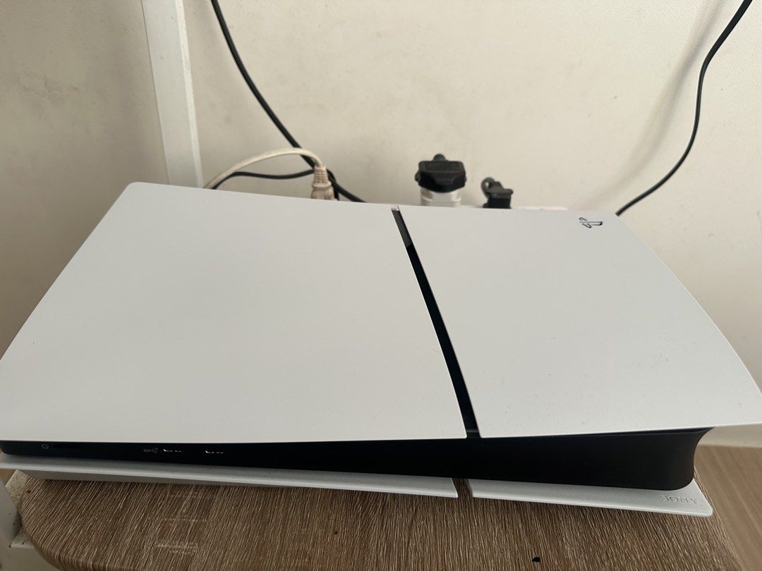 Sony PlayStation 5 Console with Games (Category: PlayStation) located in Taytay. Submitted by enthropy (Listing ID 1439470074, Image 1). Description: - PlayStation 5 console (white and black) - White controller included - Games: - Monster Hunter Rise - Minecraft - Digimon Story: Cyber Sleuth - Complete Edition - All games in original cases - Console shown on a stand.
