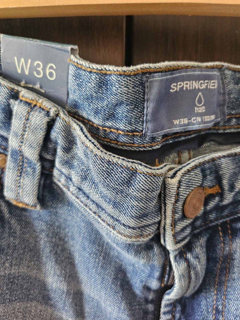 Springfield Distressed Jeans W36 (Category: Jeans) located in Makati City. Submitted by stephdzn (Listing ID 1439484725, Image 3). Description: - Springfield jeans - Light blue wash with distressed details - Size: W36 - Original price: P3,450 (tag included) - Classic five-pocket design - Button closure - Straight leg fit.