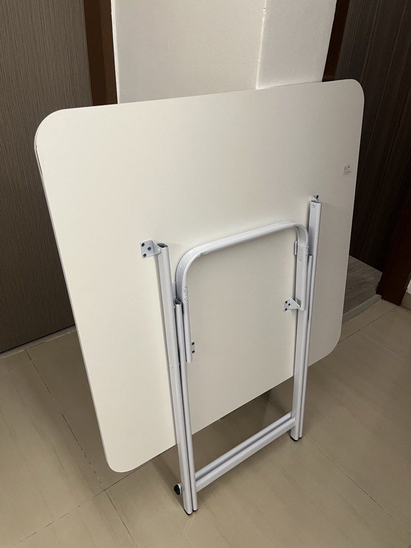 Square Table (Category: Tables & Sets) located in Singapore. Submitted by maxxfong (Listing ID 1439535045, Image 2). Description: - Square marble-look table with white surface and grey veining. - Sleek, modern design. - Ideal for small spaces or as an accent set..
