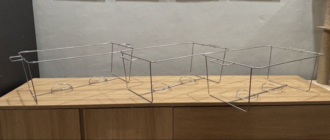 Stainless Steel Chafing Dish Frame (Category: Other Kitchenware & Tableware) located in Mandaluyong City. Submitted by carol_0368 (Listing ID 1439455855, Image 2). Description: - Stainless steel chafing dish frame - Designed for rectangular food pans - Simple wire construction - Includes two supports for fuel cans - Ideal for buffet or food service use -for Foil Tray Use Only -Never used SIZE: Height: 8 inches Lenght: 20 inches Width: 12 inches 3
