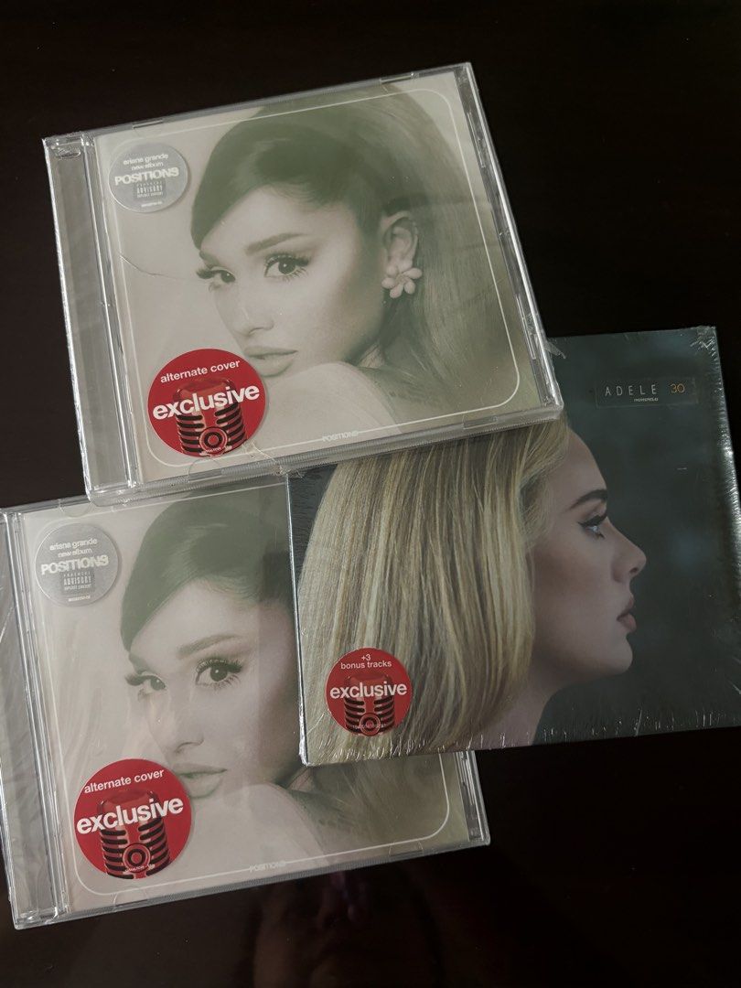 SUPERSALE Target Exclusive Ariana Grande Positions CD, Adele 30 CD (Category: CDs & DVDs) located in Manila. Submitted by stefandraboutique (Listing ID 1439460376, Image 1). Description: - Ariana Grande "Positions" CD (Alternate Cover) - Sealed, Target Exclusive - Adele "30" CD - Sealed, Target Exclusive with Bonus Tracks - All CDs are brand new..