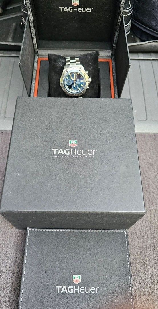 TAG Heuer Aquaracer Automatic Chronograph Watch (Category: Men's Watches) located in Manila. Submitted by watchphil (Listing ID 1439510280, Image 2). Description: - Authentic TAG Heuer Aquaracer - Caliber 16 - 41mm - Automatic chronograph watch - Blue dial - Stainless steel case and bracelet - Date display - Includes original box and papers - Diver's helmet design on case back - Model number: CAF2112 55k Negotiable.