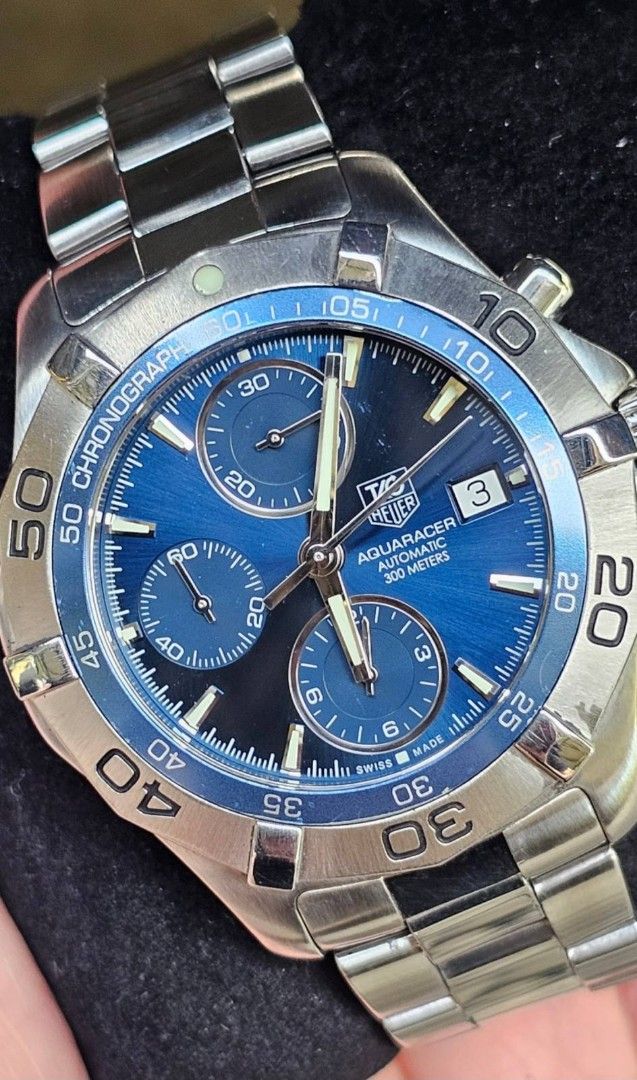 TAG Heuer Aquaracer Automatic Chronograph Watch (Category: Men's Watches) located in Manila. Submitted by watchphil (Listing ID 1439510280, Image 1). Description: - Authentic TAG Heuer Aquaracer - Caliber 16 - 41mm - Automatic chronograph watch - Blue dial - Stainless steel case and bracelet - Date display - Includes original box and papers - Diver's helmet design on case back - Model number: CAF2112 55k Negotiable.