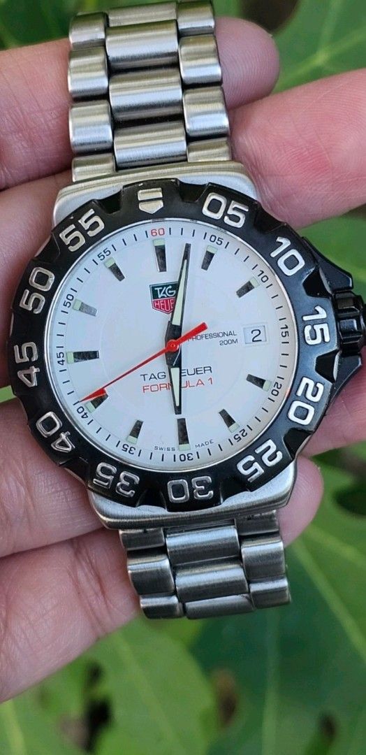Tag Heuer Formula 1 Watch WAH1111 (Category: Men's Watches) located in Manila. Submitted by watchphil (Listing ID 1439496032, Image 2). Description: - Tag Heuer Formula 1 Panda watch -WAH1111 -41mm - White dial with luminous markers and hands - Black bezel with minute markers - Date display at 3 o'clock - Stainless steel bracelet - Brand name engraved on the case - Professional 200m water resistance 35k.