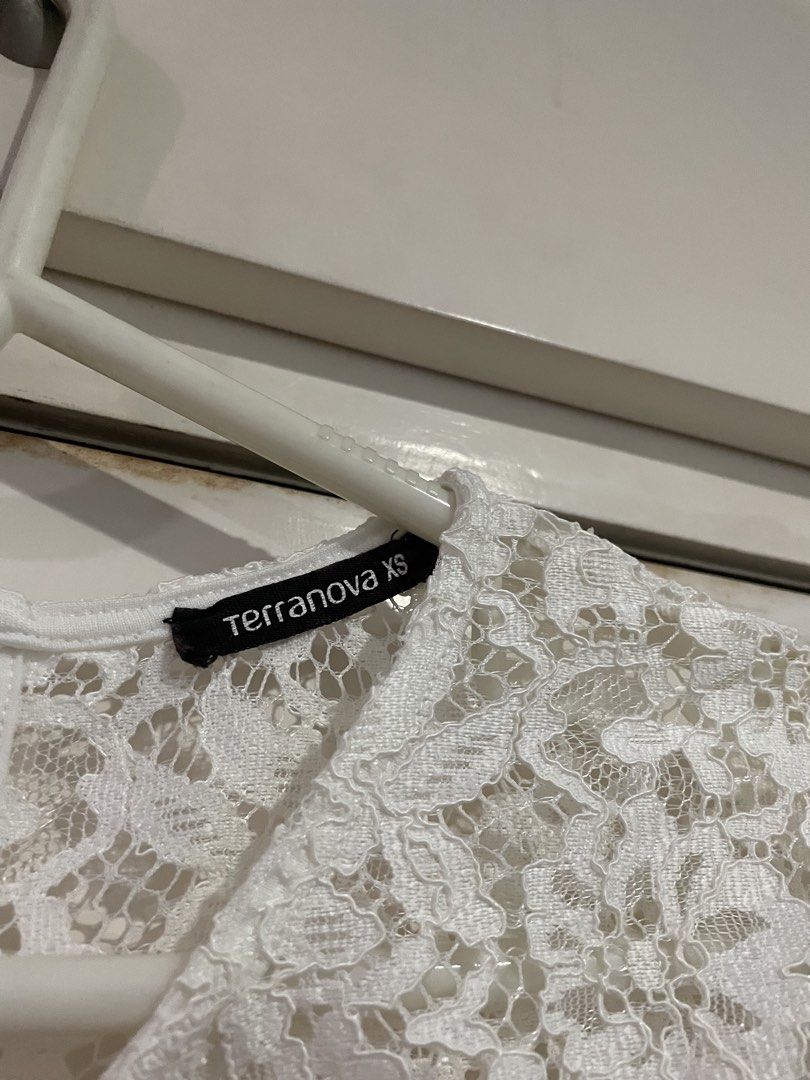 Terranova White Lace Top XS (Category: Blouses) located in Makati City. Submitted by Pinksisters (Listing ID 1439569236, Image 2). Description: - Terranova white lace top - Size: XS - Features a round neckline - Short sleeves - Great for layering - A versatile wardrobe piece.