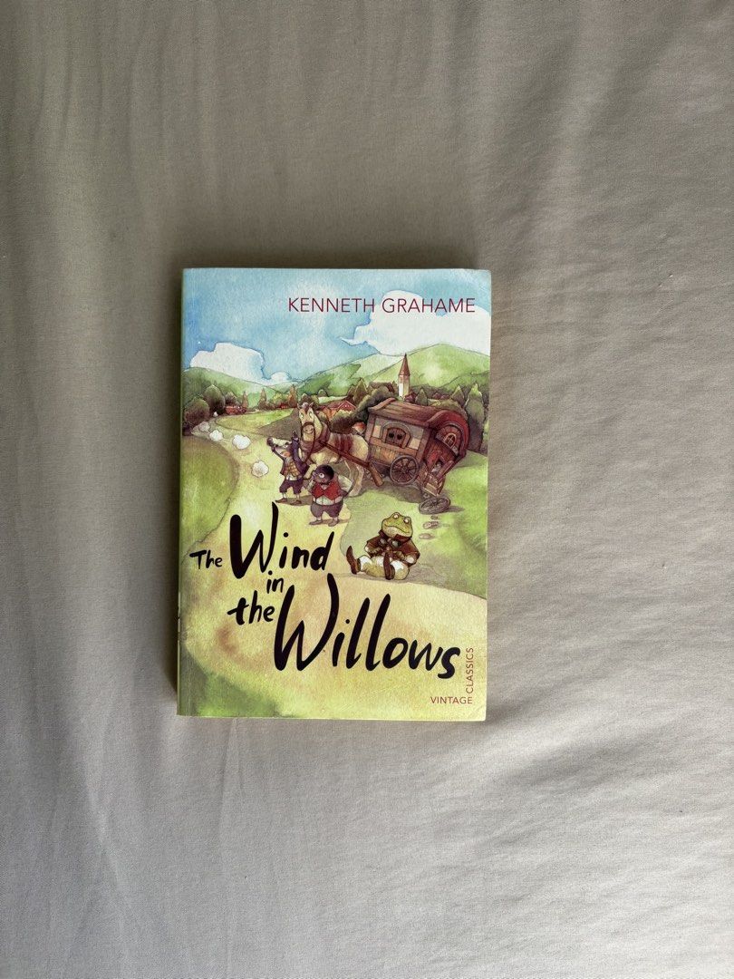 The Wind in the Willows by Kenneth Grahame (Category: Storybooks) located in Santa Rosa. Submitted by annesclosetgw (Listing ID 1439522985, Image 1). Description: - "The Wind in the Willows" by Kenneth Grahame - Vintage Classics edition - Original unabridged text - English language - Features cover illustration with characters and carriage - Back cover includes story summary.