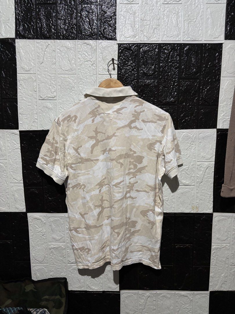 Tommy Hilfiger Camouflage Polo Shirt (Category: Tshirts & Polo Shirts ) located in Lopez. Submitted by thrift.ni.roms22 (Listing ID 1439600286, Image 2). Description: - Tommy Hilfiger polo shirt - Camouflage pattern - Classic polo collar - Short sleeves - Tommy Hilfiger logo on chest - Button-up placket - Breathable fabric - Ideal for casual wear.