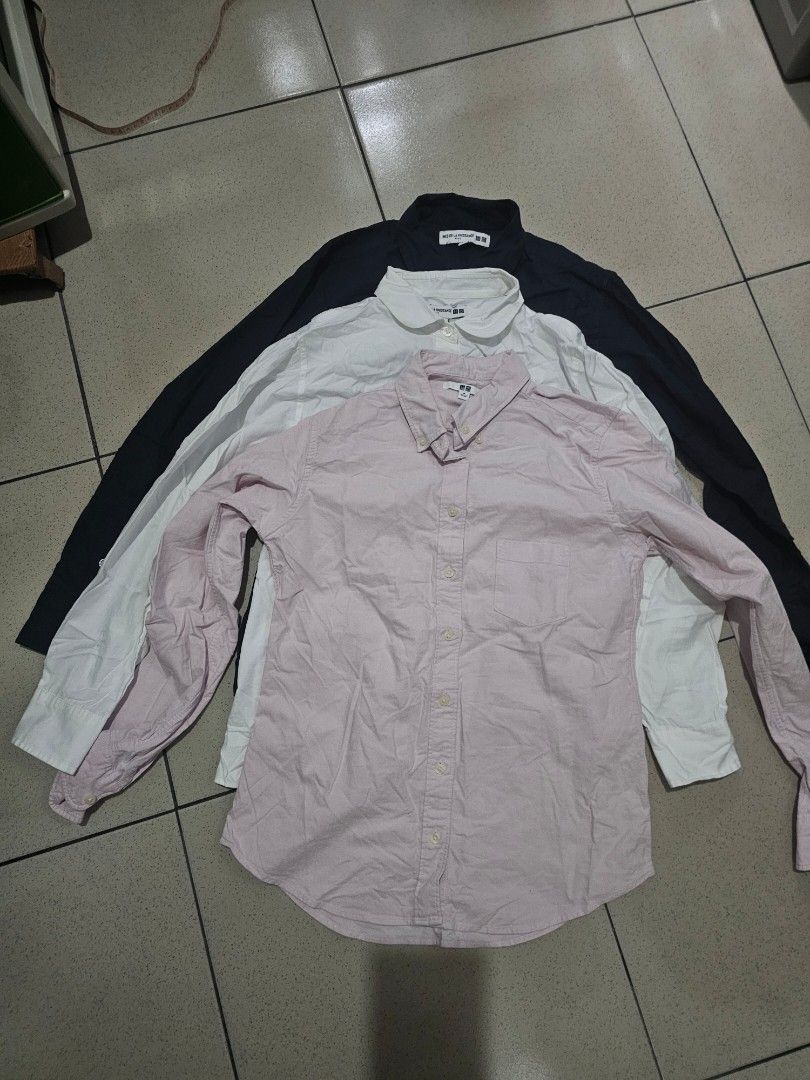 Uniqlo Long Sleeve Shirts (Category: Coats, Jackets and Outerwear) located in Marikina City. Submitted by charmaine185845 (Listing ID 1439523454, Image 1). Description: - Set of three Uniqlo long sleeve shirts - Colors: Navy blue and White (Ines De La Fressange) and Pink Oxford - Features button-down closures and collared necks - Pink : Medium - White and Navy Blue : Small.