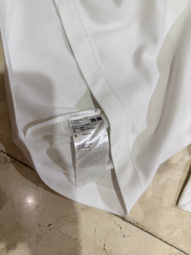 Uniqlo White T-shirt (Category: Tshirts & Polo Shirts ) located in Meycauayan. Submitted by sweet.cherry.ph (Listing ID 1439494084, Image 3). Description: - Uniqlo crew neck t-shirt - Size: M - Made in Vietnam - Material: 100% polyester - Condition: Good Bust tape measure flat lay- 20 inches Length- 20.5 inches .