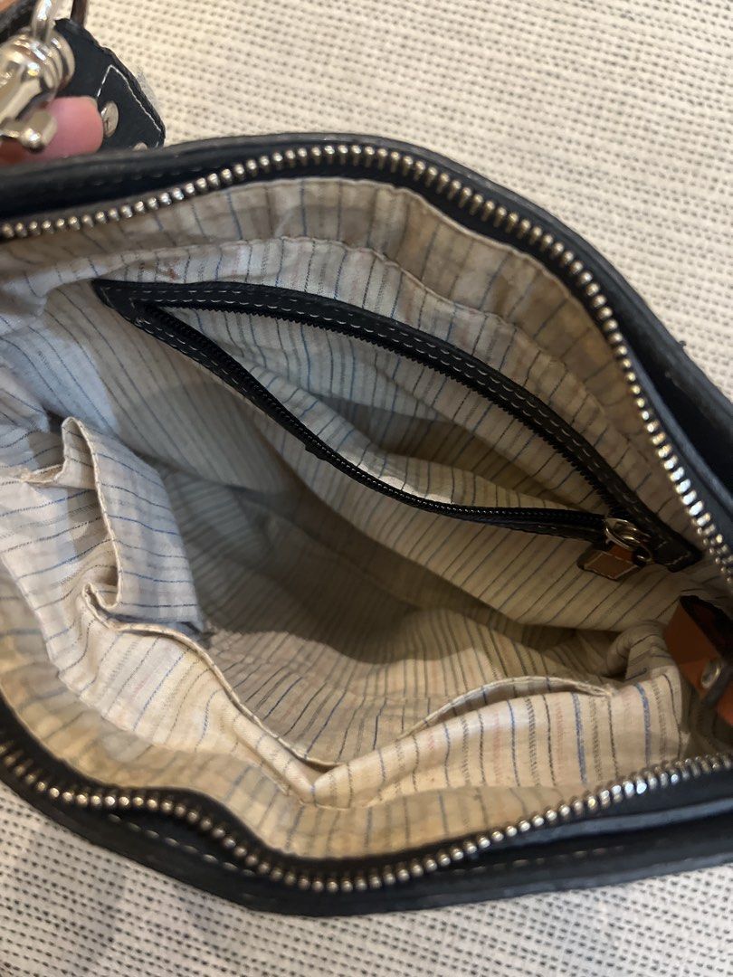 Vintage Coach sling bag with Charm (Category: Other Accessories) located in Makati City. Submitted by makenziet (Listing ID 1439531723, Image 3). Description: - Cream and brown Coach bag strap - Includes a "COACH" charm - Silver clasps - Crossbody strap.