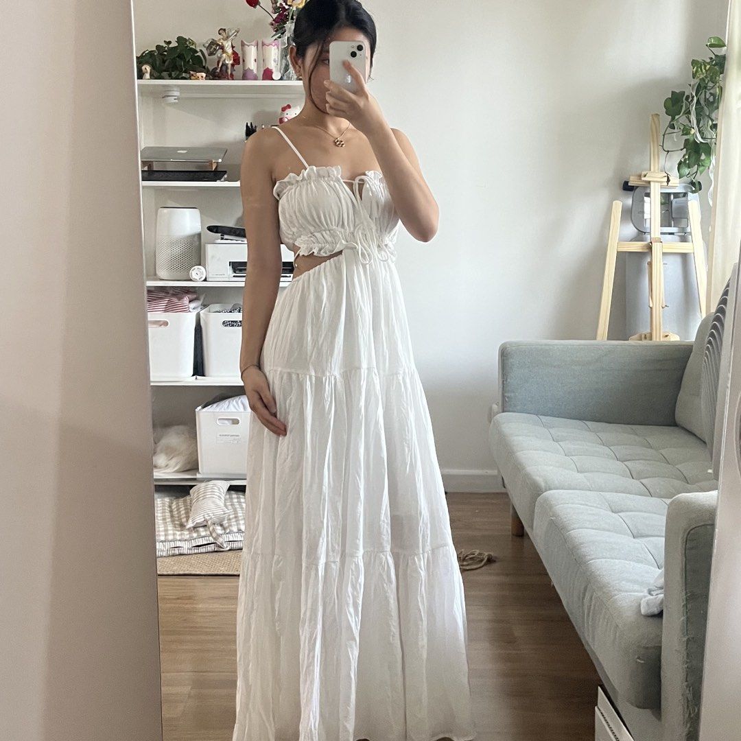 White Maxi Dress with Cutouts (Category: Dresses) located in Manila. Submitted by maechann (Listing ID 1439511154, Image 3). Description: - Elegant white maxi dress - Delicate spaghetti straps - Tiered skirt - Unique waist cutout - Tie detail at bust - Low back design - Ideal for summer or special occasions size S-semi medium.