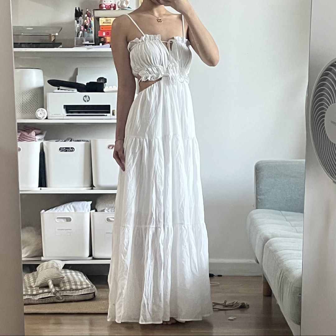 White Maxi Dress with Cutouts (Category: Dresses) located in Manila. Submitted by maechann (Listing ID 1439511154, Image 2). Description: - Elegant white maxi dress - Delicate spaghetti straps - Tiered skirt - Unique waist cutout - Tie detail at bust - Low back design - Ideal for summer or special occasions size S-semi medium.