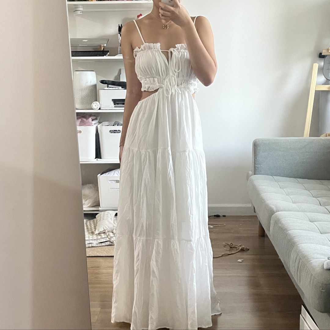 White Maxi Dress with Cutouts (Category: Dresses) located in Manila. Submitted by maechann (Listing ID 1439511154, Image 1). Description: - Elegant white maxi dress - Delicate spaghetti straps - Tiered skirt - Unique waist cutout - Tie detail at bust - Low back design - Ideal for summer or special occasions size S-semi medium.