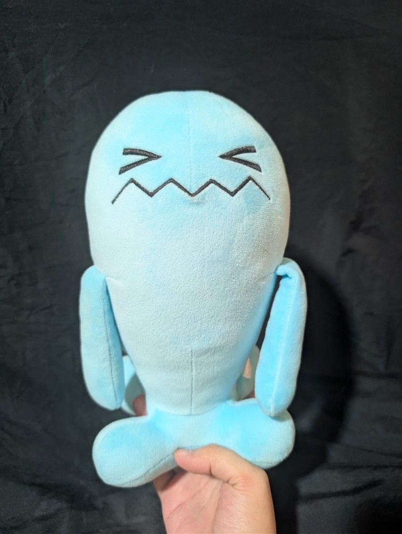 Wobbufet Plush Toy (Category: Toys & Games) located in Malabon City. Submitted by apatoys (Listing ID 1439599275, Image 1). Description: - Adorable blue plush toy - Unique stitched face design - Soft and cuddly material - Small arms and feet - Great for collectors or gifting.