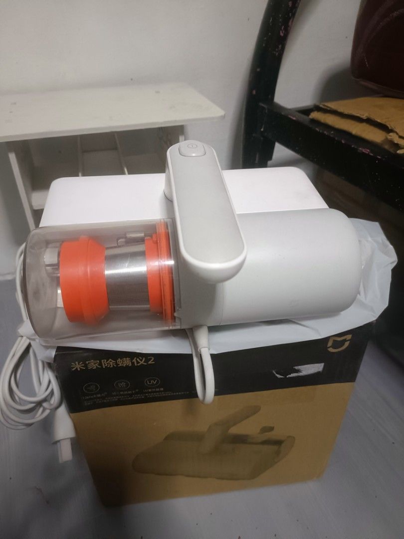 Xiaomi Mijia 2 Handheld Vacuum Cleaner (Category: Vacuum Cleaner & Housekeeping) located in Manila. Submitted by lilyappliance (Listing ID 1439600947, Image 2). Description: - New Xiaomi Mijia 2 handheld vacuum cleaner. - Color: White with orange accents. - Features a transparent dust cup. - Ergonomic handle for easy use. - Comes with the original box, which includes an image of the vacuum and Chinese characters..